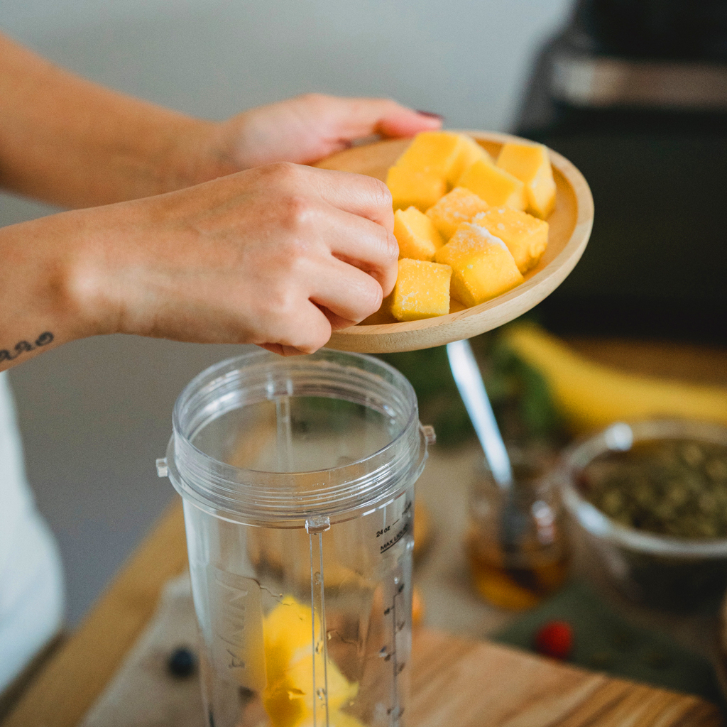 Preparing mangos for no bake mango cheesecake 